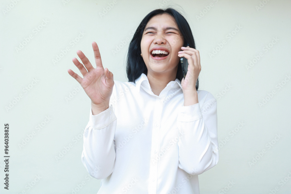 carefree beauty asian business woman laughing fun speaking on smartphone with raising palms wearing white suit shirt rejoicing standing over isolated background, wireless communication concept carefree beauty asian business woman laughing fun speaking on smartphone with raising palms wearing white suit shirt rejoicing standing over isolated background, wireless communication concept