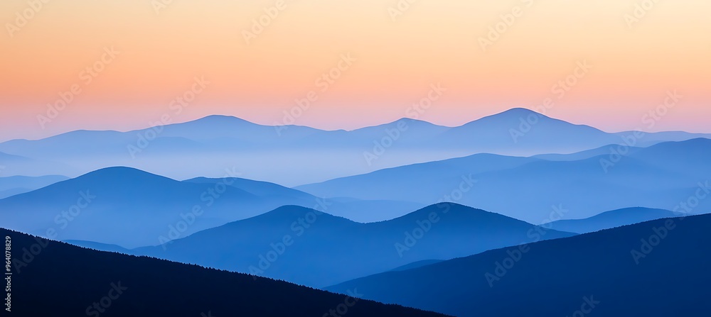 Obraz premium A serene, mountain landscape at dusk with a clear sky and text space