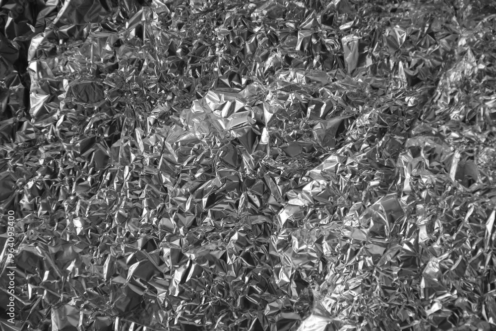 Processed collage of shiny metal silver gray foil crumpled packaging material texture Processed collage of shiny metal silver gray foil crumpled packaging material texture