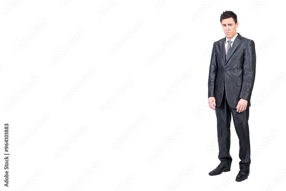 Upset young man in classy suit looking at camera Upset young man in classy suit looking at camera