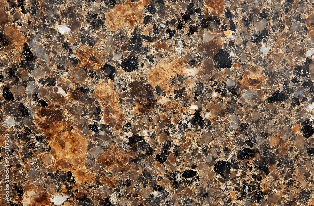 An hyper-realistic texture of dark brown granite with small white and grey specks An hyper-realistic texture of dark brown granite with small white and grey specks