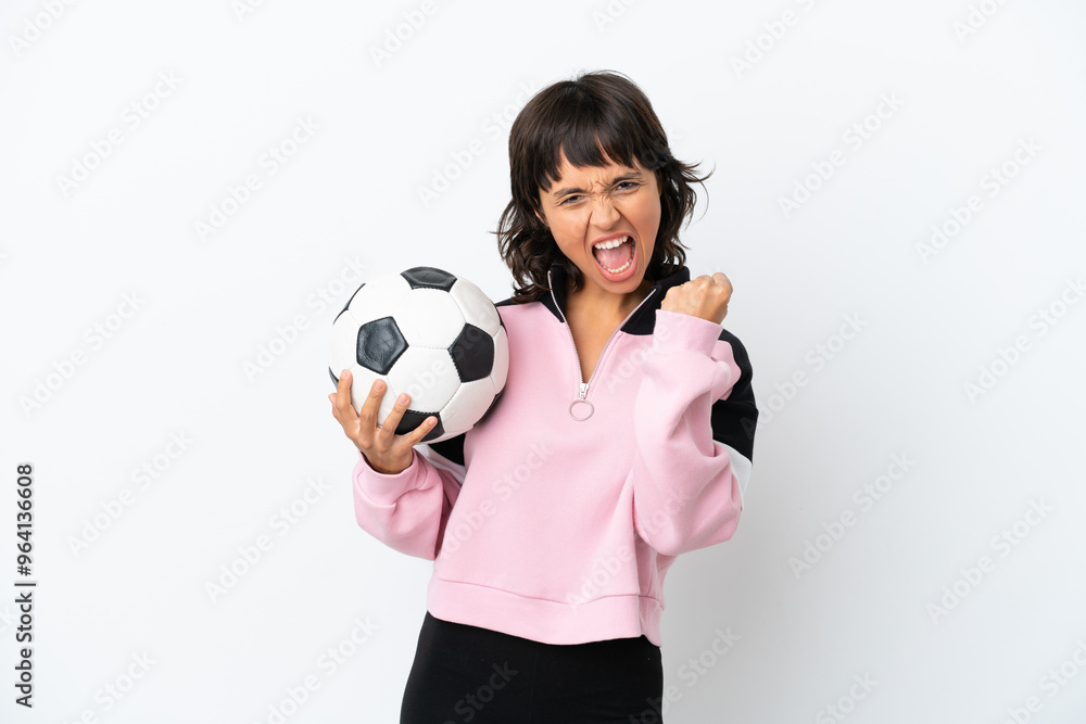 Young mixed race woman isolated on white background with soccer ball celebrating a victory Young mixed race woman isolated on white background with soccer ball celebrating a victory
