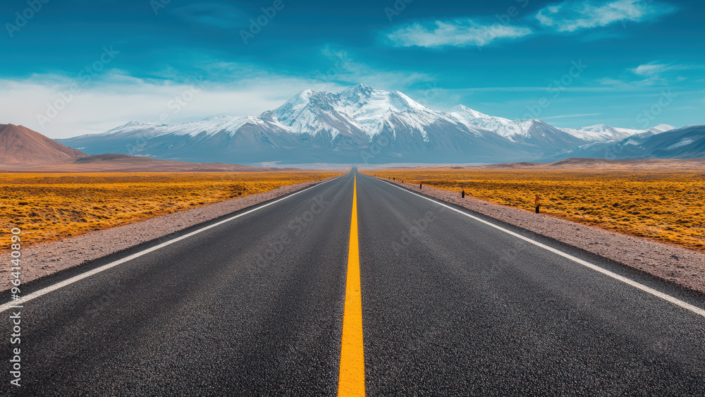 A straight road leading under a snow-capped mountain. A straight road leading under a snow-capped mountain.
