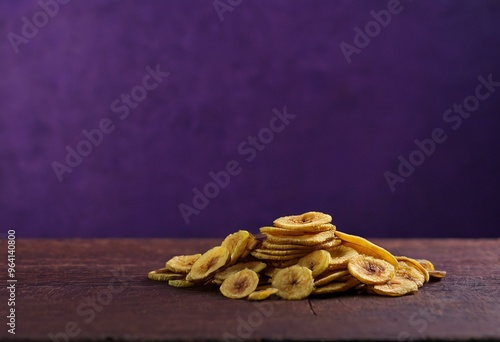 Dried Banana Slices on Purple Background