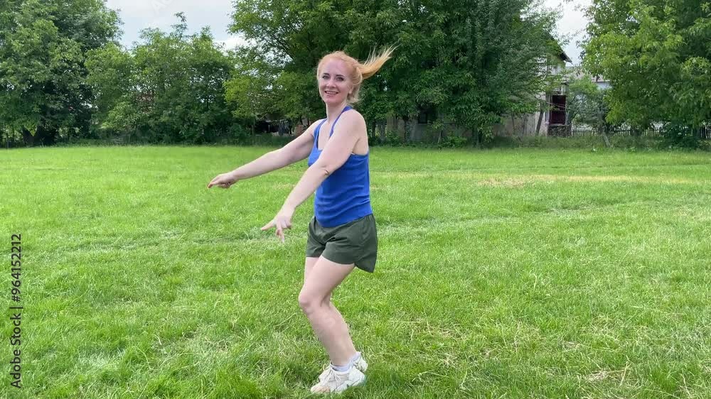Young woman dancing joyfully in a sunny field, embracing freedom and happiness amidst nature's beauty Young woman dancing joyfully in a sunny field, embracing freedom and happiness amidst nature's beauty