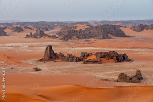 The Tadrart Rouge means Red Mountain. It is a mountain range in southeastern Algeria. The area has a rich array of rock art. photo