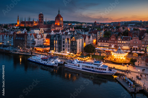 Gdansk, Poland - July 18, 2024: The Main Town of Gdansk by the Motlawa river at dusk, Poland.