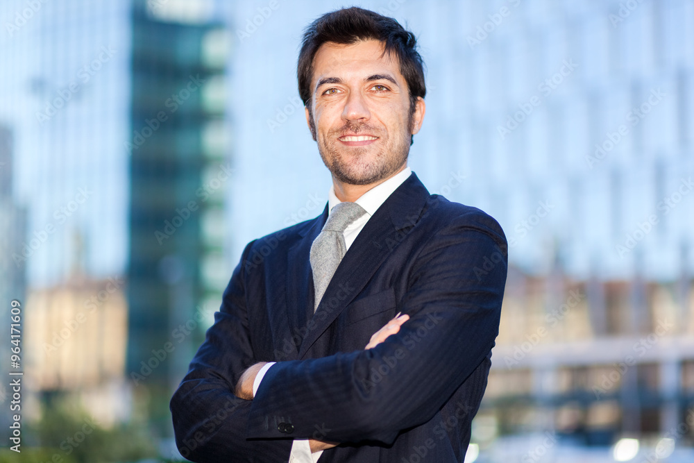 Confident businessman outside office building Confident businessman outside office building