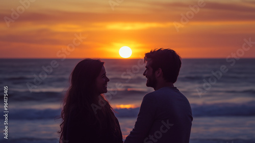 A couple is smiling and hugging at the beach