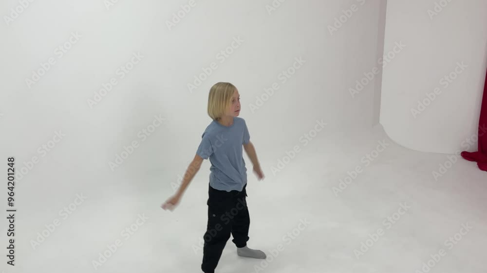 Young dancer practicing modern dance poses in a bright white studio, showcasing creativity and athleticism through movement Young dancer practicing modern dance poses in a bright white studio, showcasing creativity and athleticism through movement