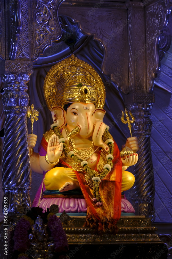 Fototapeta premium 07 September 2024, Pune, Maharashtra, India, Beautiful sculpture of Lord Ganesh called as Tambdi Jogeshwari Ganpati near ABC chowk, Pune, during Ganesh Utsav Festival 2024.