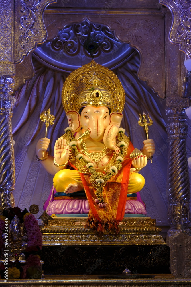Fototapeta premium 07 September 2024, Pune, Maharashtra, India, Beautiful sculpture of Lord Ganesh called as Tambdi Jogeshwari Ganpati near ABC chowk, Pune, during Ganesh Utsav Festival 2024.