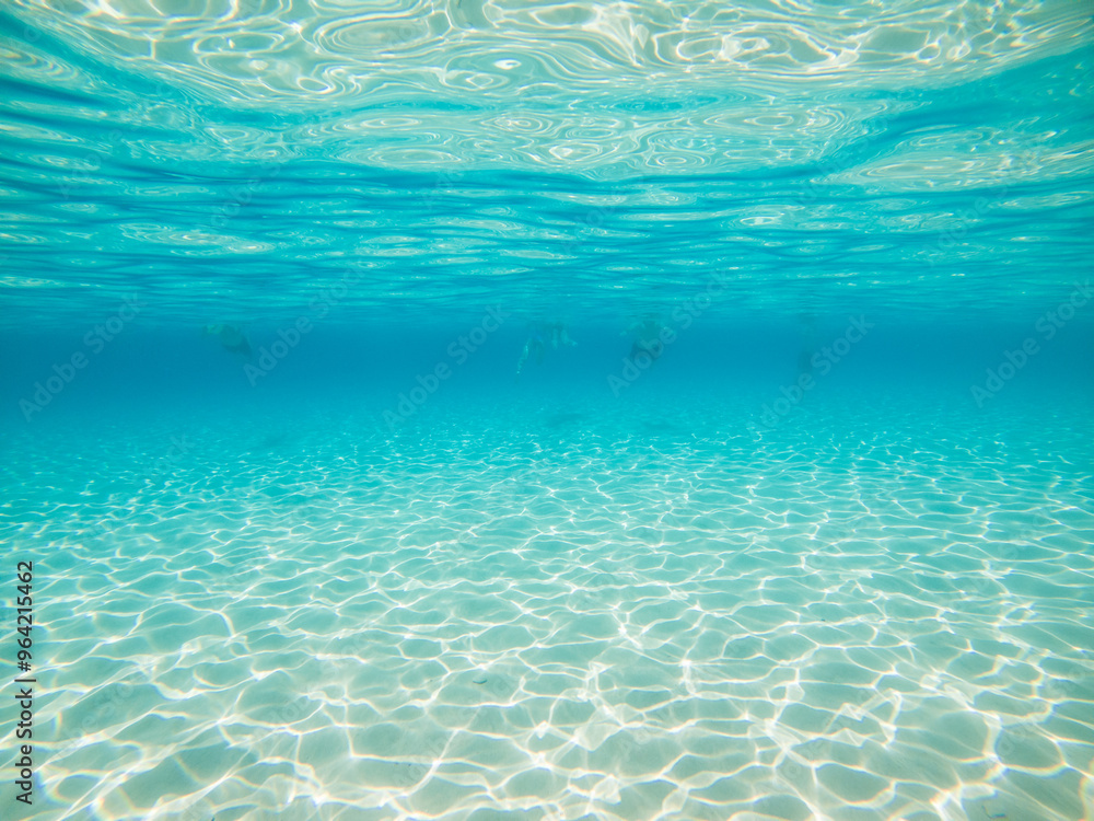 Turquoise waters and white sand in Mediterranean Sea in Blue Lagoon, Malta Island touristic landmark Turquoise waters and white sand in Mediterranean Sea in Blue Lagoon, Malta Island touristic landmark