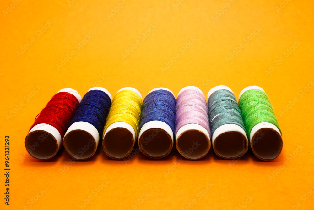 several rolls of colorful sewing thread several rolls of colorful sewing thread