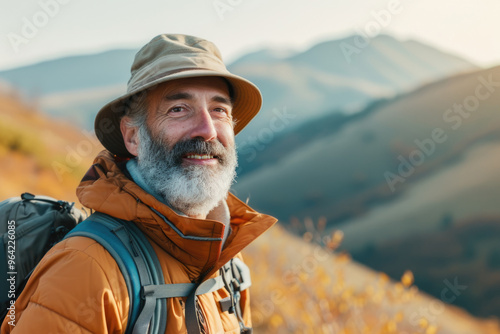 Elderly man enjoying a picnic in the park with a fruit basket