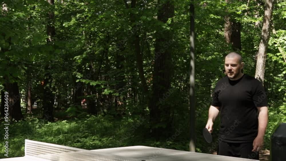 Ping pong player, involved in a table tennis competition, hitting the ball during an intense match.