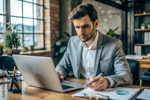 Business Professional Analyzing Data in Modern Office with Exposed Brick Walls