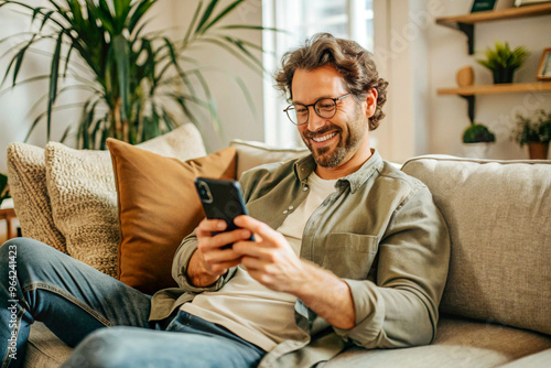 Man Relaxing on Beige Sofa in Modern Living Room with Potted Plants and Decor