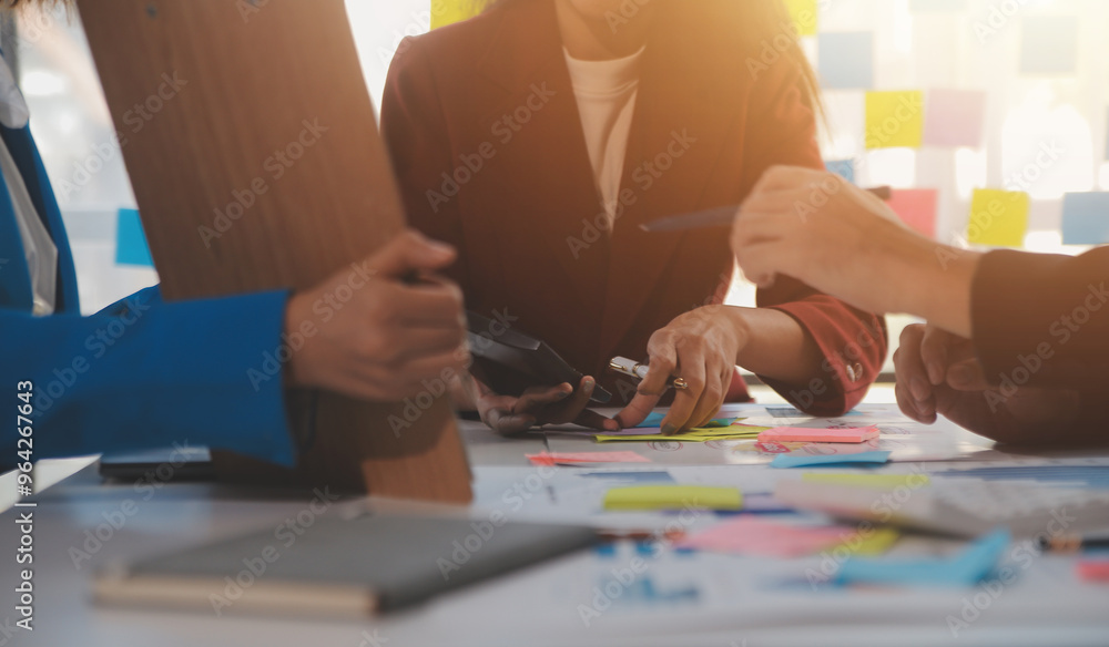 Meeting with business partners to discuss financial advisors to analyze market growth charts in business reports and plan investment strategies. Meeting with business partners to discuss financial advisors to analyze market growth charts in business reports and plan investment strategies.