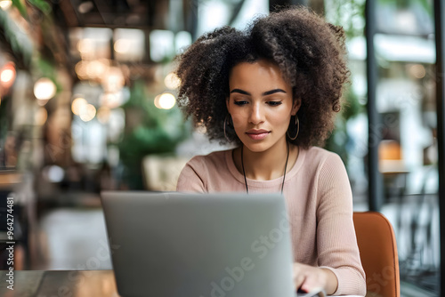 Young beautiful woman working laptop a modern workspace