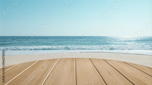 Wooden circular deck on sandy beach with ocean waves and clear sky in backdrop. Product display background with copy space.