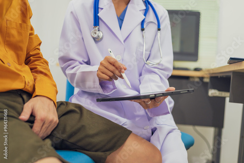 A female doctor performs a check for an enlarged prostate, evaluating male health issues such as prostate enlargement, urinary symptoms, and other related conditions to ensure accurate diagnosis photo