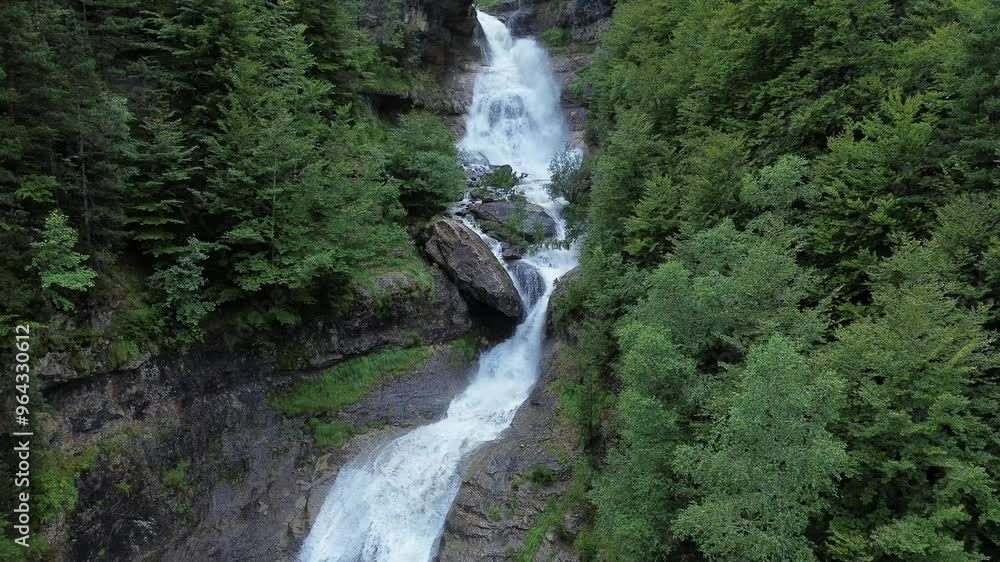 Waterfall in the Pyrenees forest background aerial view Waterfall in the Pyrenees forest background aerial view
