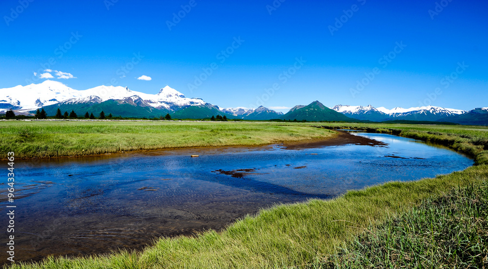 Creek with Aleutian Range in Hallo Bay, Katmair, Alaska, U.S. Creek with Aleutian Range in Hallo Bay, Katmair, Alaska, U.S.
