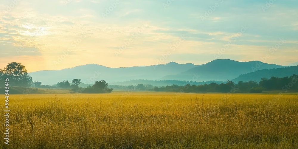 A serene landscape showcasing golden fields under a soft sunrise, with distant mountains creating a tranquil backdrop. A serene landscape showcasing golden fields under a soft sunrise, with distant mountains creating a tranquil backdrop.