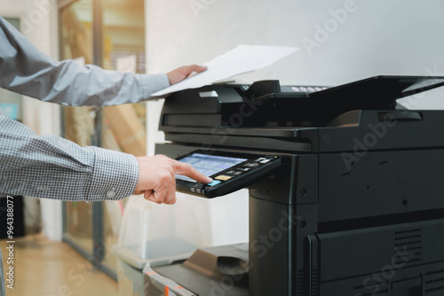 Hand use copier or photocopier or photocopy machine office equipment workplace for scanner or scanning document or printer for printing paperwork hard copy duplicate Xerox service maintenance repair. photo