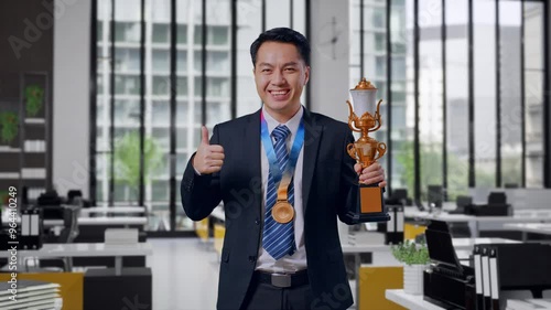 Wallpaper Mural Asian Business Man In A Suit And Tie With A Gold Medal And Trophy Showing Thumbs Up Gesture And Smiling To Camera As The First Winner In Office Torontodigital.ca