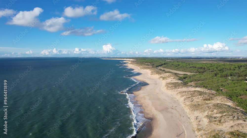 Aerial view of the village of Soulac-sur-Mer, nestled in Gironde along the Atlantic coast. This picturesque village embodies the iconic charm of the Médoc region. Aerial view of the village of Soulac-sur-Mer, nestled in Gironde along the Atlantic coast. This picturesque village embodies the iconic charm of the Médoc region.