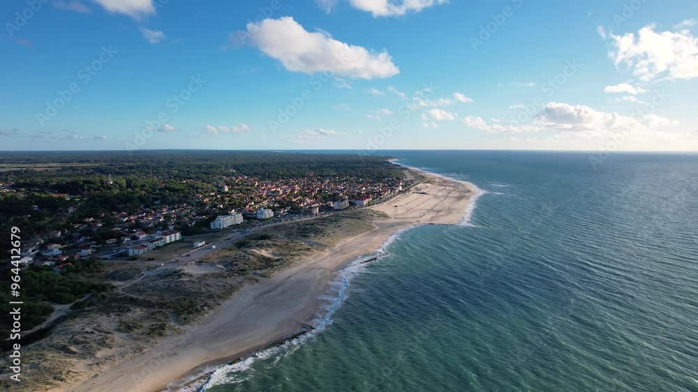 Aerial view of the village of Soulac-sur-Mer, nestled in Gironde along the Atlantic coast. This picturesque village embodies the iconic charm of the Médoc region. Aerial view of the village of Soulac-sur-Mer, nestled in Gironde along the Atlantic coast. This picturesque village embodies the iconic charm of the Médoc region.