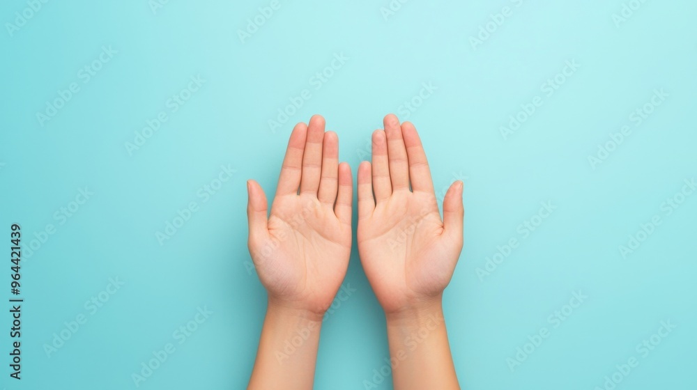 Open hands against a soft blue background, symbolizing openness, support, and connection. Perfect for various themes. Open hands against a soft blue background, symbolizing openness, support, and connection. Perfect for various themes.
