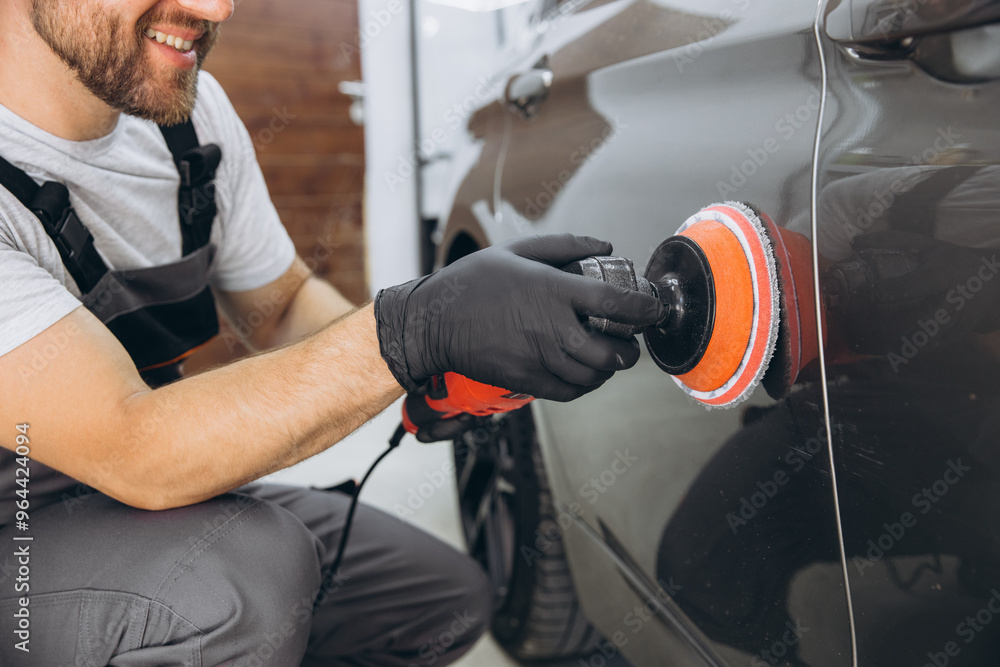 Professional Car Detailing with an Auto Polisher in a Garage Setting Professional Car Detailing with an Auto Polisher in a Garage Setting