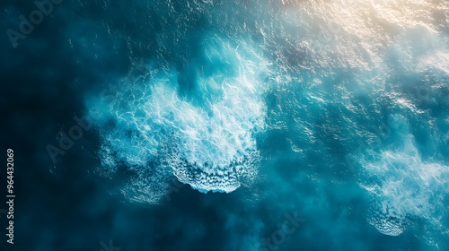 Aerial view of swirling ocean waves and currents, creating a dynamic and textured pattern of blue water and white foam. photo