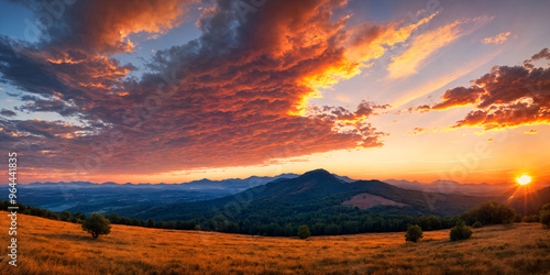 Golden sunset over mountain landscape, with panoramic views and tranquil orange skies creating a serene, calm atmosphere perfect for summer relaxation and capturing the beauty of nature