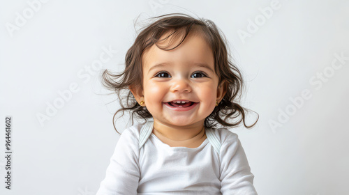 Portrait of Happy Hispanic toddler girl, sitting joyfully ,isolated on a pure white background