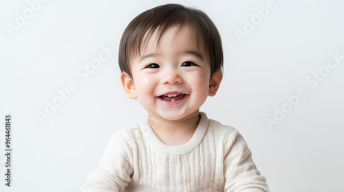 Portrait of Happy Asian toddler boy, sitting cheerfully ,isolated on a pure white background