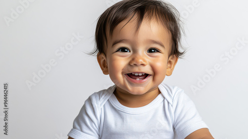 Portrait of Smiling Latina toddler boy, sitting joyfully ,isolated on a pure white background