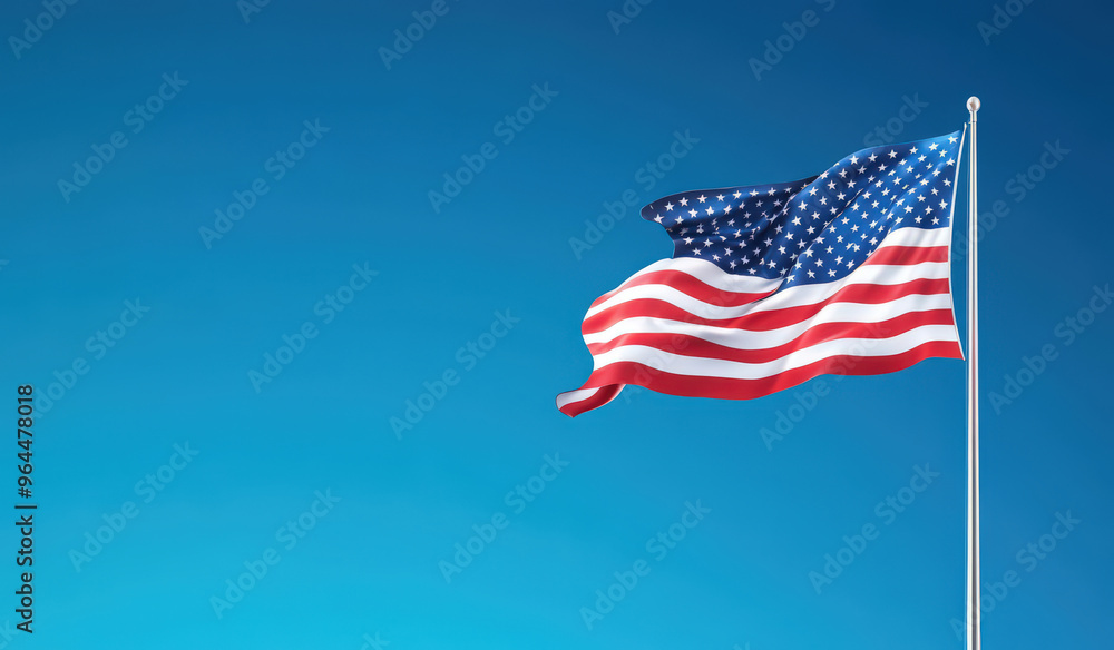 Fototapeta premium Waving American Flag Against Clear Blue Sky