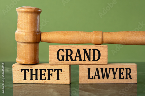 Fototapeta GRAND THEFT LAWYER - words on wooden blocks with a judge's gavel in the backgrou