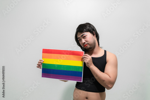 LGBT Pride month concept,Asian Handsome male make up and wear woman cloth,Gay Freedom Day,Portrait of Non-binary on white background photo