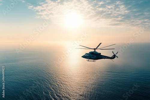 A military helicopter flying over the open sea.