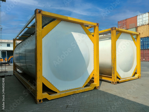 ISO tank container with white cylindrical tanks suitable for industrial, construction, manufacturing, fuel, gas and transportation photo