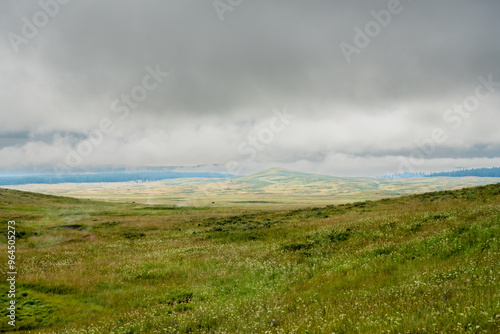 Clouds Hang Low Over The Swooping HIlls Of The Mary Mountain Trail