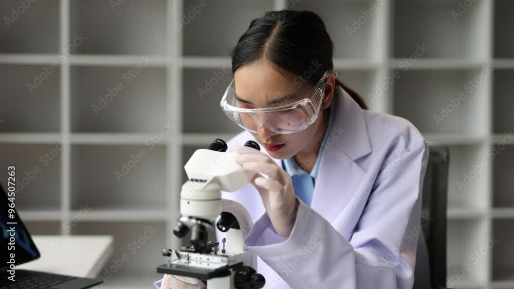 Female doctor or scientist in laboratory using microscope. Female doctor or scientist in laboratory using microscope.