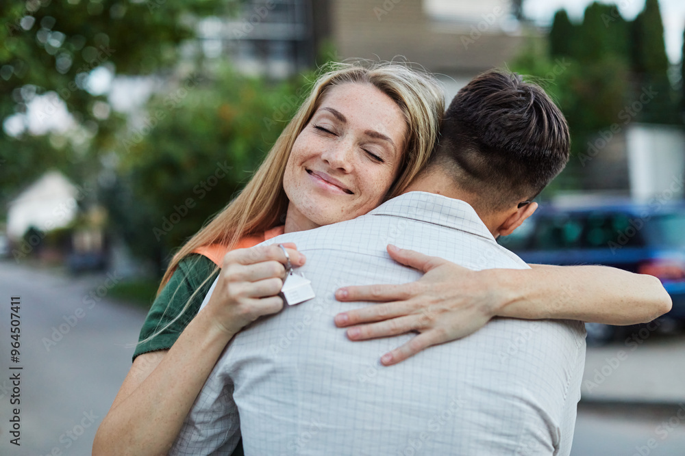 key woman man house new apartment home wife husband owner real estate togetherness couple buying happy young married together family property portrait