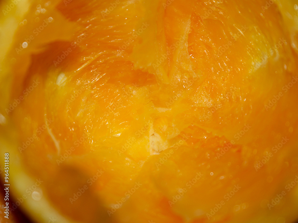 close up of an orange. orange with selective focus. orange background. orange remains. close up of an orange. orange with selective focus. orange background. orange remains.