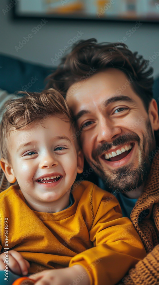 Happy Father and Child Smiling Together on a Cozy Couch - Family Bonding Moments Happy Father and Child Smiling Together on a Cozy Couch - Family Bonding Moments